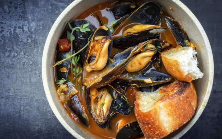 Traditional French Corsican mussel stew with mussels as top view
