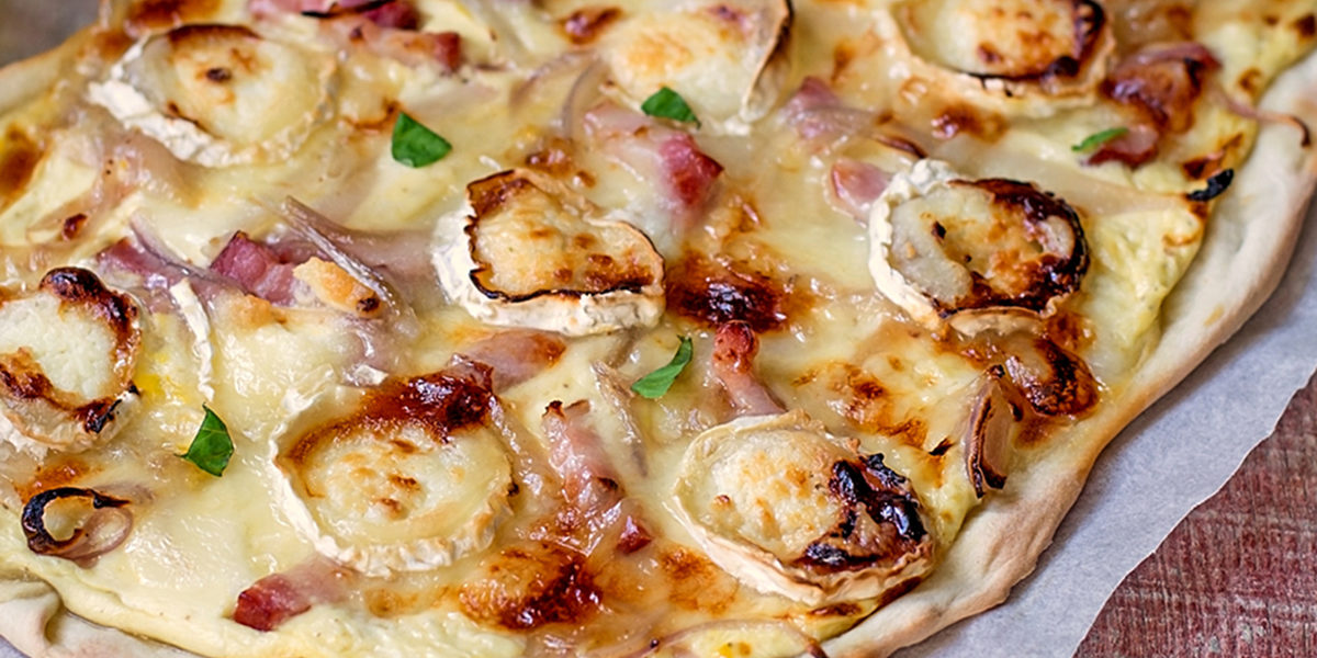French traditional dish Flammekueche with goat cheese Flammekueche