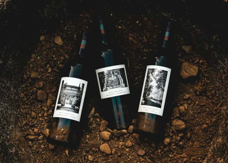 Three bottles of Gravel Series wines set in Round Pond Soil