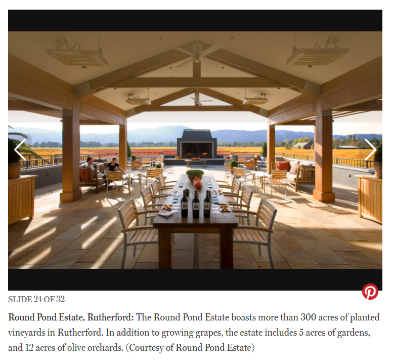 Scenic outdoor dining area at Round Pond Estate with vineyard views in Napa Valley.