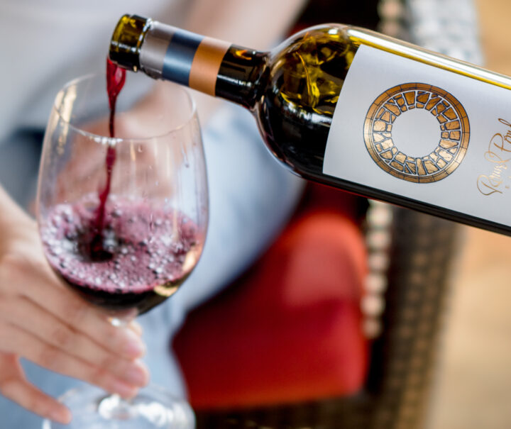 Wine being poured into a glass at a restaurant