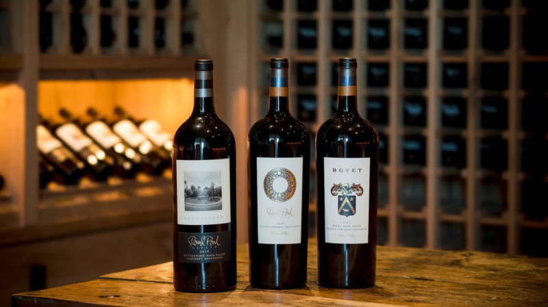 Three Large Format Bottles in a Wine Cellar
