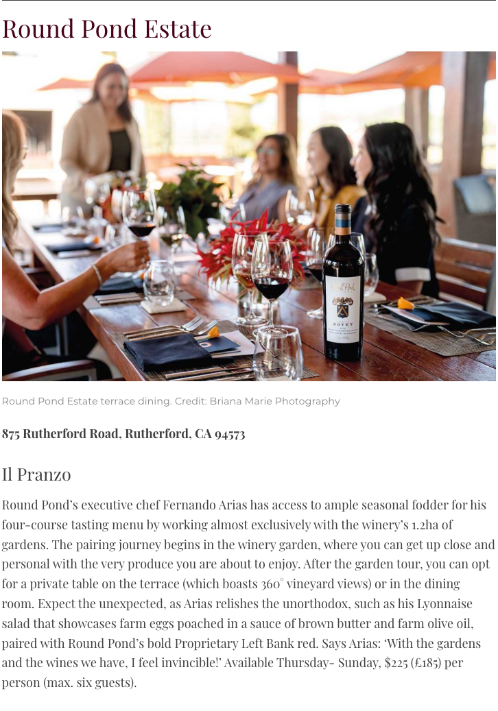 Elegant wine tasting at Round Pond Estate with guests enjoying wine and food.