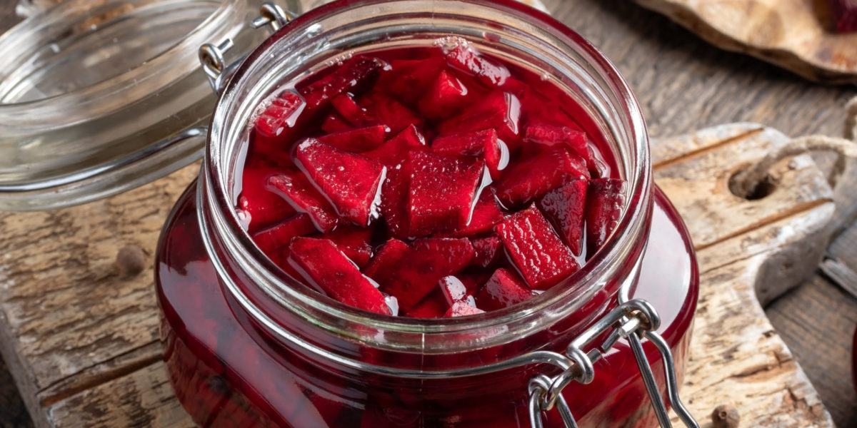 Preparation of kvass - fermented red beets, in a glass jar