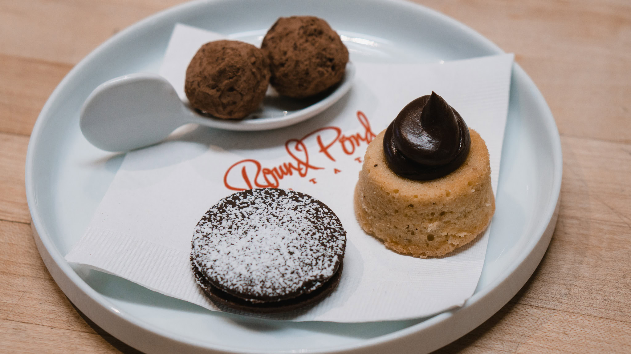 Round Pond mignardises — shortbread cookies, salted chocolate caramel, and cocoa nib truffles.