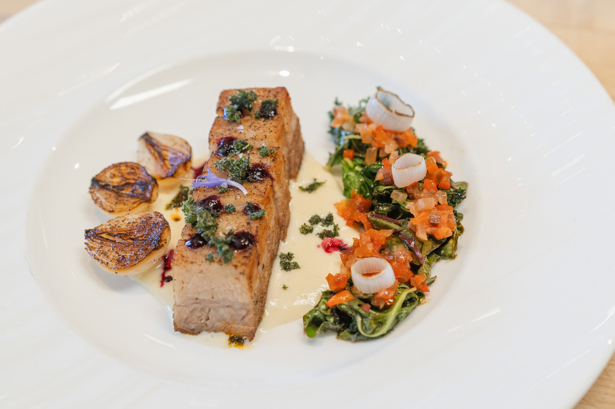 Roasted pork belly with onion soubise.