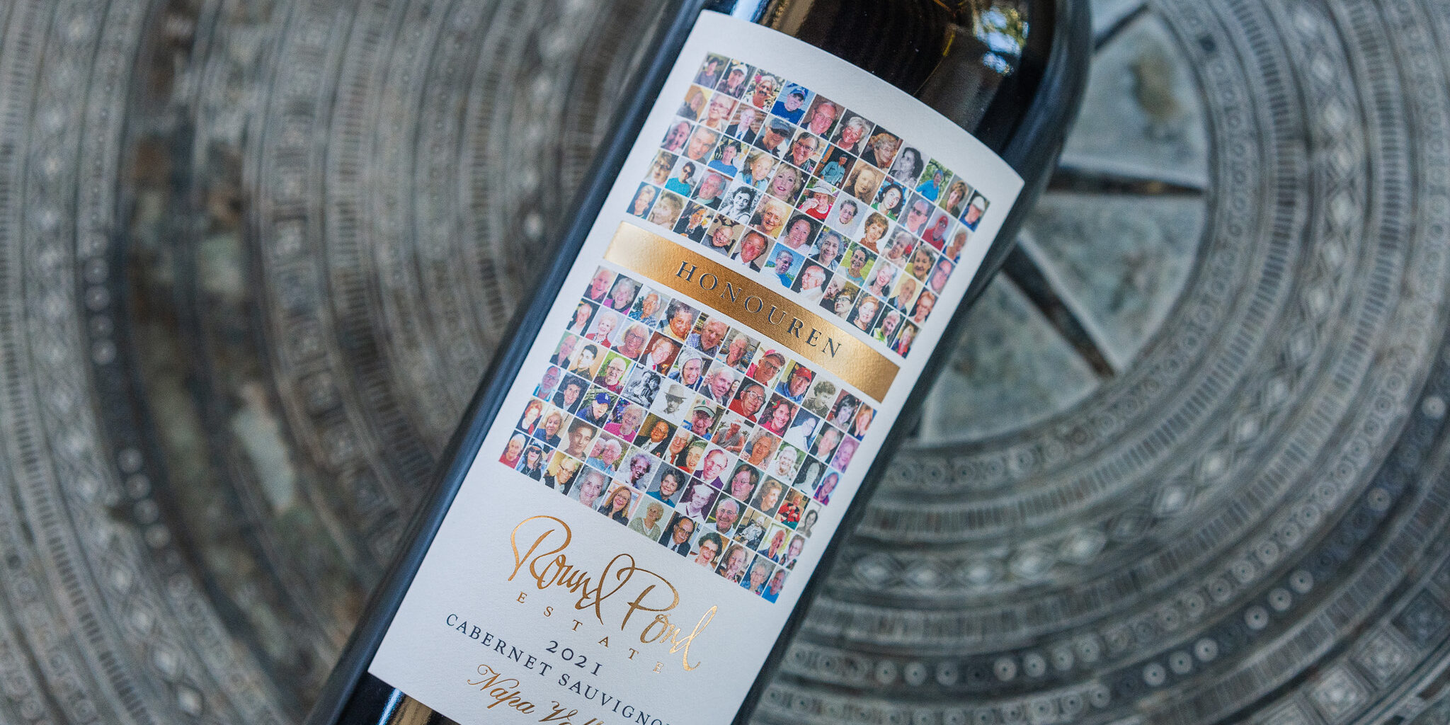 Honouren Cabernet Sauvignon bottle laid down on a concrete surface