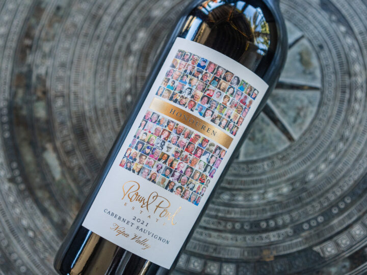 Honouren Cabernet Sauvignon bottle laid down on a concrete surface