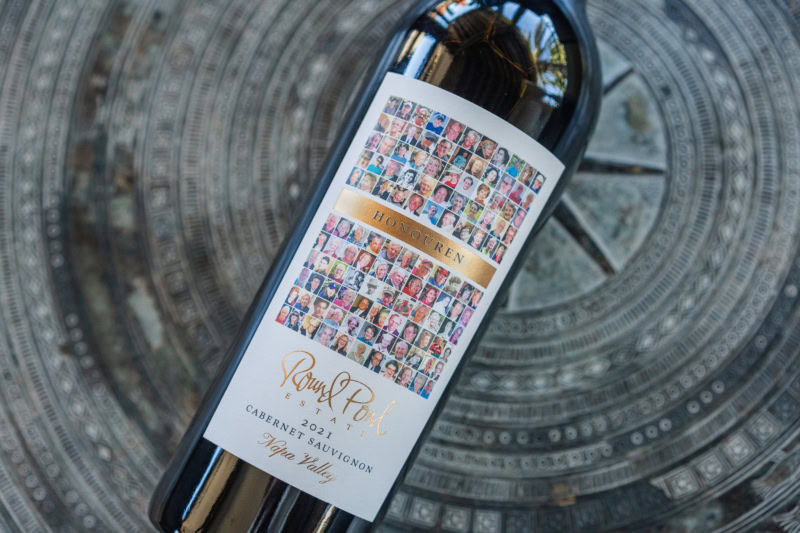 Honouren Cabernet Sauvignon bottle laid down on a concrete surface