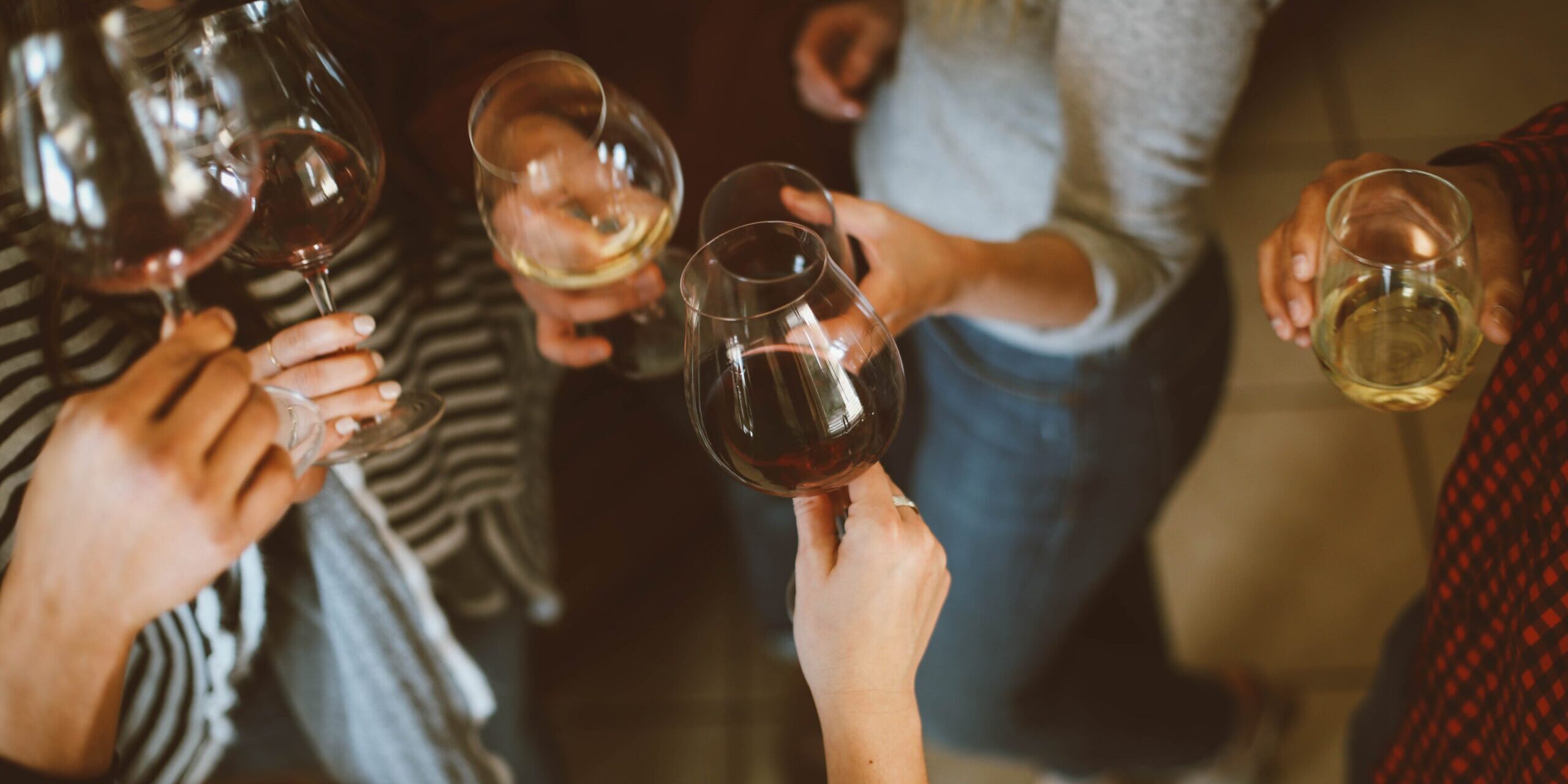 Wine glasses Many hands holding red and white wine glasses