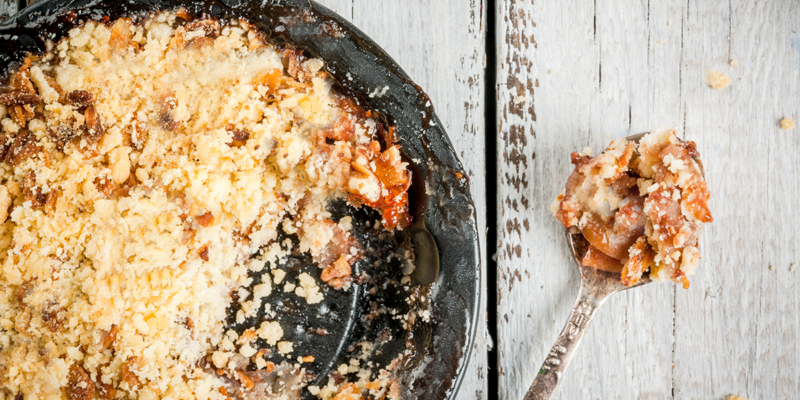 Delicious Nana’s Apple Pudding served with a crumb topping.