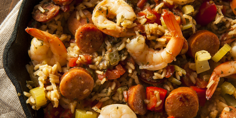 A flavorful dish featuring shrimp, sausage, rice, and vegetables in a savory jambalaya.