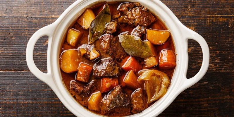 Delicious wine country beef stew with tender beef, potatoes, carrots, and herbs in a rich broth. Perfect for cozy meals.