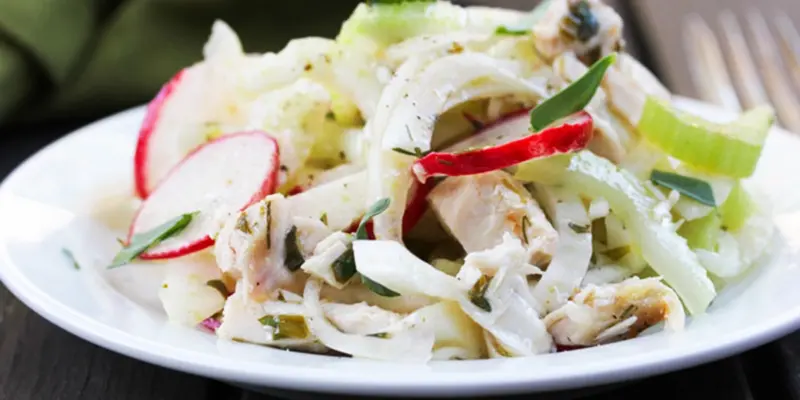 Delicious grilled chicken and fennel salad with fresh vegetables.
