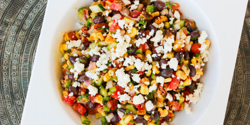 Bright, colorful roasted corn salad with diced vegetables and crumbled cheese. Perfect for a fresh, flavorful side dish.